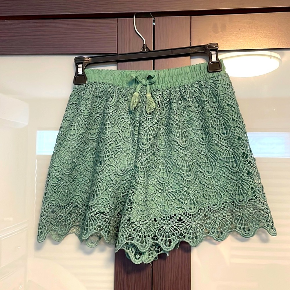 Dark green lace shorts. Art class.